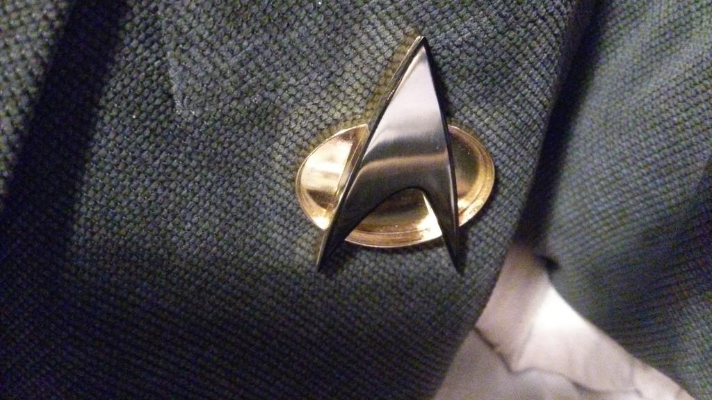 TNG combadge